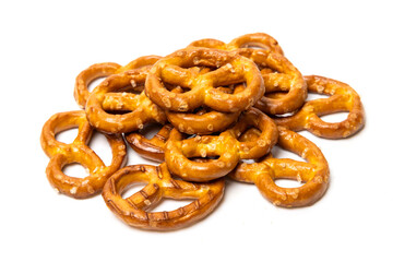 Small traditional beer pretzels with salt isolated on white background