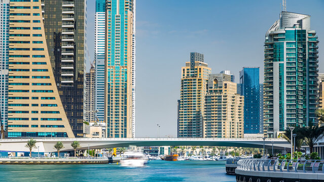Dubai Marina modern towers in Dubai at day time timelapse - Powered by Adobe