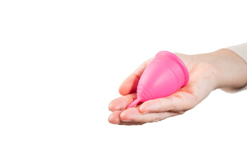 in female hands pink menstrual cup. pink menstrual cup on light background. close-up of hand with menstrual cup. Zero waste concept. Alternative feminine hygiene product