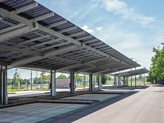 solar canopy at an empty charging station on an ev. parking lot