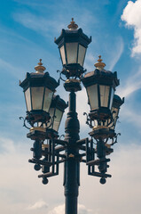 City street lantern on blue sky background