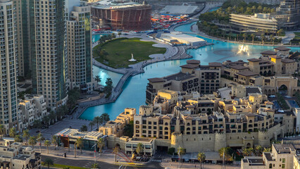 Obraz premium Top view of the bridge over man-made lake timelapse in Dubai downtown, United Arab Emirates.