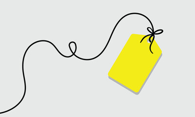 White rectangular tag with rounded corners hanging from a string with a bow on a soft background