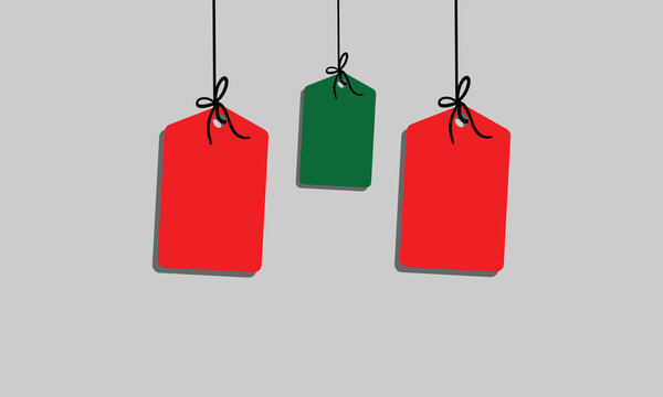 White rectangular tag with rounded corners hanging from a string with a bow on a soft background
