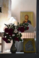 flowers, icons and frescoes in the church