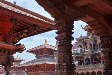 Intricately carved Newari temple structures in Patan Durbar Square, Nepal, showcasing ancient...