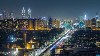 Fototapeta premium Jumeirah Palm island skyline night timelapse in Dubai, UAE.