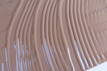 A sample of the delicate texture of liquid foundation. natural of a decorative liquid product. chic cosmetic background for product advertising