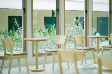 Cafe tables and chairs are made of wood. Cafe or restaurant interior decoration chair