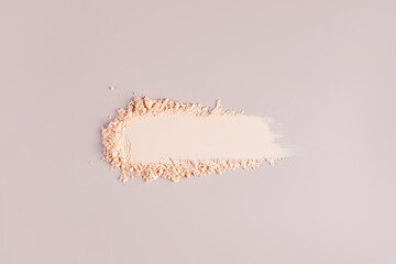 A chic example of the texture of a compact powder in a natural tone. texture of decorative cosmetics. copy space. A sample to advertise your product.