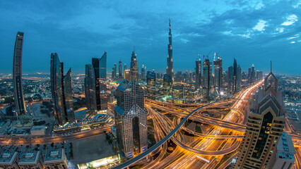 Obraz premium Modern skyscrapers and busy evening highways day to night timelapse in luxury Dubai city, Dubai, United Arab Emirates