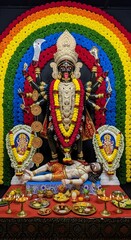 Kali puja celebration images: hindu goddess kali statue with offerings and colorful decoration