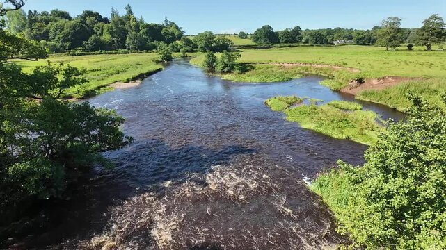 Drymen Glasgow Scotland UK. 08.07.2025. Video. An overview of the fast flowing Endrick Water at Drymen village flowing to Loch Lomond Western Scotland. UK.