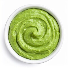 Obraz premium Creamy Green Avocado Dip in White Bowl Top View.