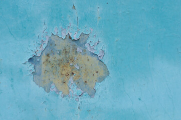 Old blue background with peeling paint and rusted metal surface.