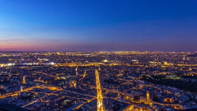 Panorama of Paris after sunset day to night timelapse. Top view from montparnasse building in Paris - France