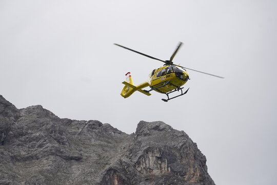 Christophorus 14 Eurocopter EC 135 operated by Austrian Red Cross. The yellow helicopter is used for mountain rescue in the high Alps. Near Dachstein massif, Styria, Austria.