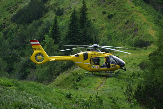 Christophorus 14 Eurocopter EC 135 operated by Austrian Red Cross. The yellow helicopter is used for mountain rescue in the high Alps. Near Dachstein massif, Styria, Austria.