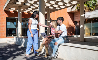 Three university students interacting in a friendly and casual way on a sunny modern campus, with...