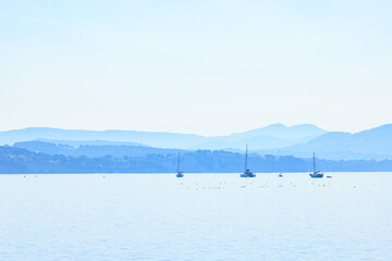 Sailboats and yachts on calm coasts Bay, in hot summer weather - The sea as a place of longing...