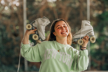figure skating athlete with skates smiling outdoors