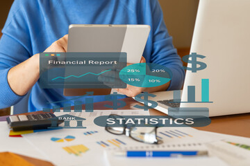 Businessman is using a tablet, analyzing financial reports and statistics with charts and graphs, focusing on business intelligence, analytics, and company performance