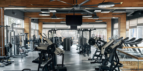 Modern gym interior with weight training machines and no people