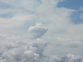 Cumulonimbus clouds, thunderheads forming within a blue sky, over Kent County, Delaware. Cloudscape.