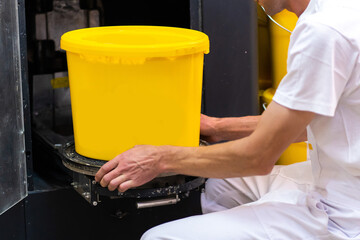 Worker and Paint dispenser. Mixer combined tinting machine. Ink mixing machine