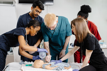 Medical Students Practicing Intubation Technique on Baby Mannequin during Training