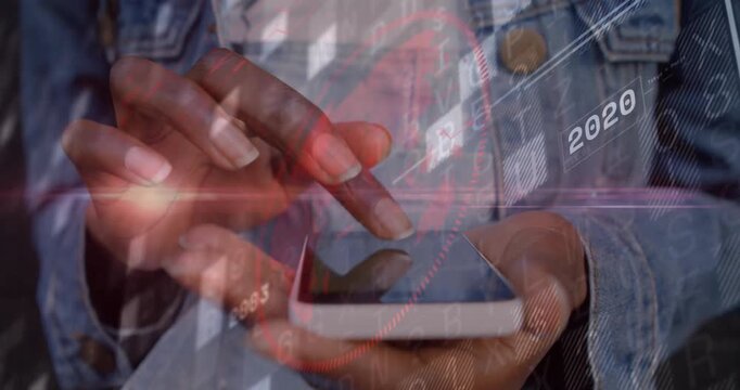 Woman tapping smartphone screen on denim jacket, reviewing past yearly data with tech overlays