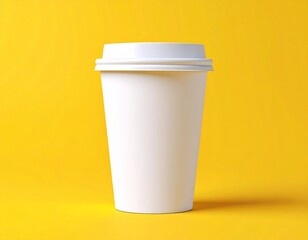 A white disposable coffee cup with a white lid on a yellow background in a studio setting simple shot