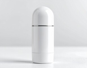 A minimalist white deodorant container with a silver accent band on a white background surface studio shot