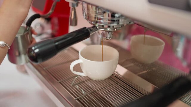 Coffee being poured into a cup from a coffee maker. Coffee making concept.