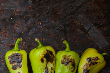 Charred Peppers on Dark Background: Unique Texture and Color