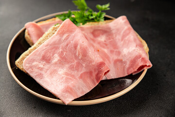 Ham slices meat spam pork fresh delicious gourmet food background on the table rustic food top view...
