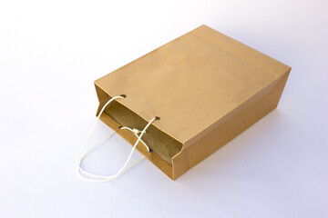 Blank brown paper bag for shopping isolated on white background