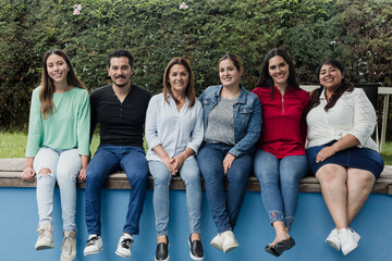 Latin multigenerational people having fun in a public park in Mexico Latin America, portrait of hispanic people 