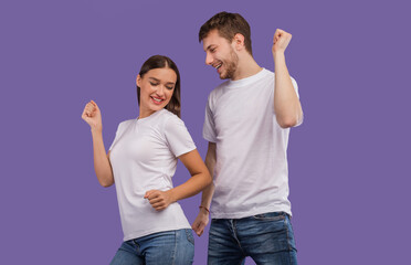 Enjoying Life. Happy partners dancing and having fun on pastel purple studio background, copyspace, isolated