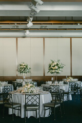 Elegant banquet setup with floral centerpieces in a sophisticated venue for a special event
