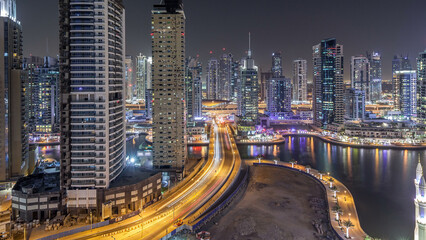 Fototapeta premium Water canal on Dubai Marina skyline at night timelapse.