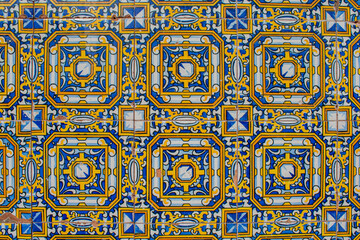 background with decorative tiles in blue and yellow in Spanish style