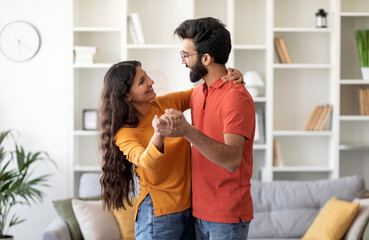 Portrait Of Romantic Young Indian Couple Dancing Together In Home Interior, Happy Millennial...