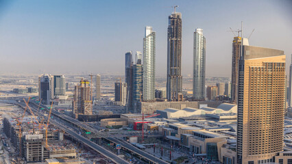 Dubai downtown skyline at sunset timelapse and road traffic near mall, UAE