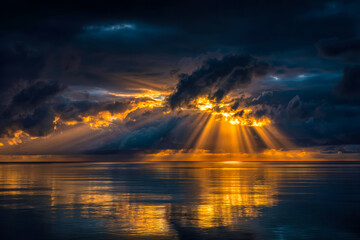 Stunning sunset over a calm sea with dramatic cloud formations and golden rays of light