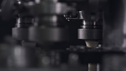 Industrial machine pressing cheese in automated