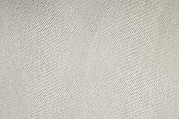 Closeup of beige twill fabric texture
