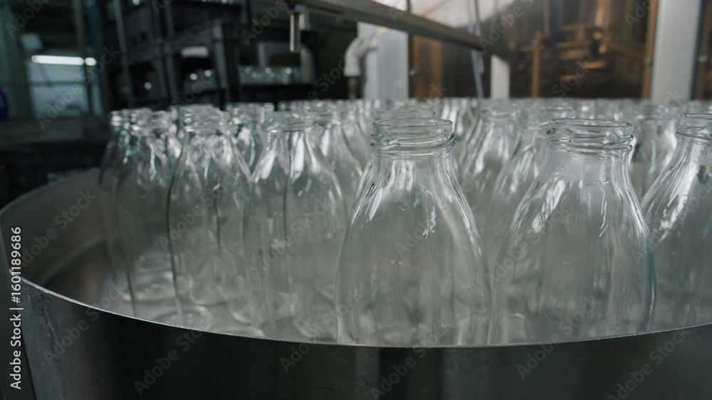 Poster empty glass bottles passing through quality