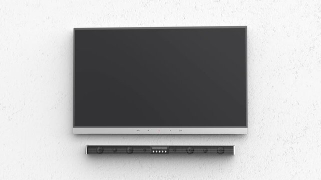 Widescreen TV and soundbar mounted on a white wall
