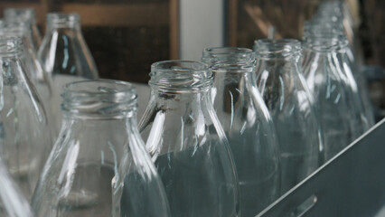 Empty glass bottles waiting for filling on